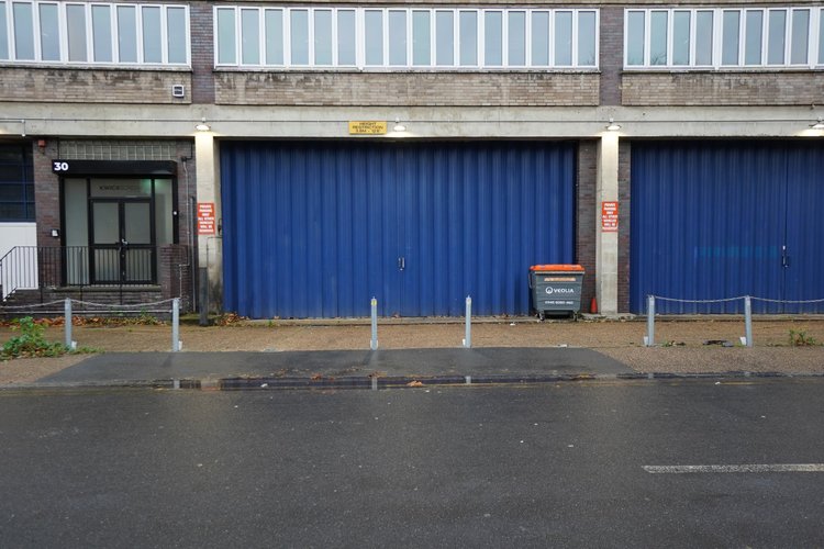 Blue loading doors and the adjoining entrance from Engate Street.