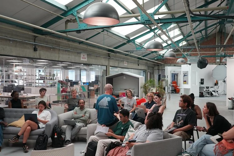 Participants gathered for a discussion in Blue Garage’s shared workspace.