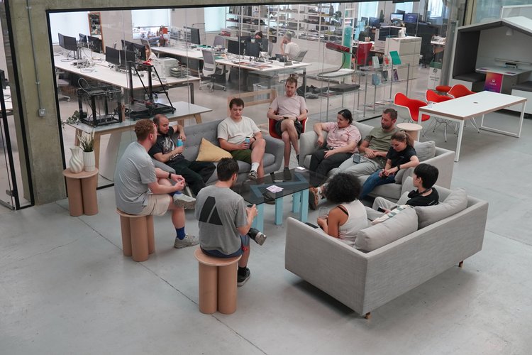 Members gathering in the shared lounge at Blue Garage